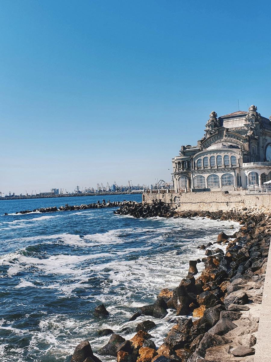 Photo by Odette Ion white building near shore