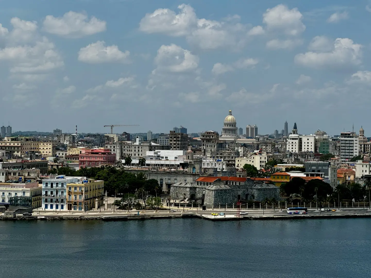 Photo by Pavel A large body of water with a city in the background